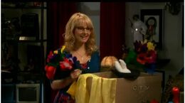 Bernadette holding magic equipment
